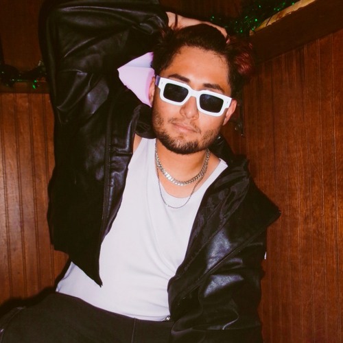 SXCTIME in white sunglasses and a black leather jacket.